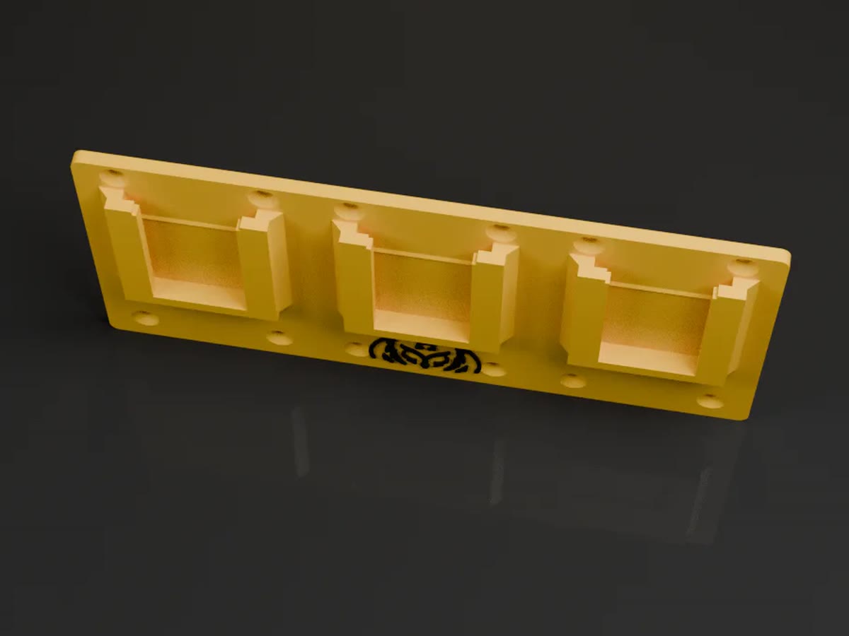 Yellow 3D-printed triple battery holder for a van wall