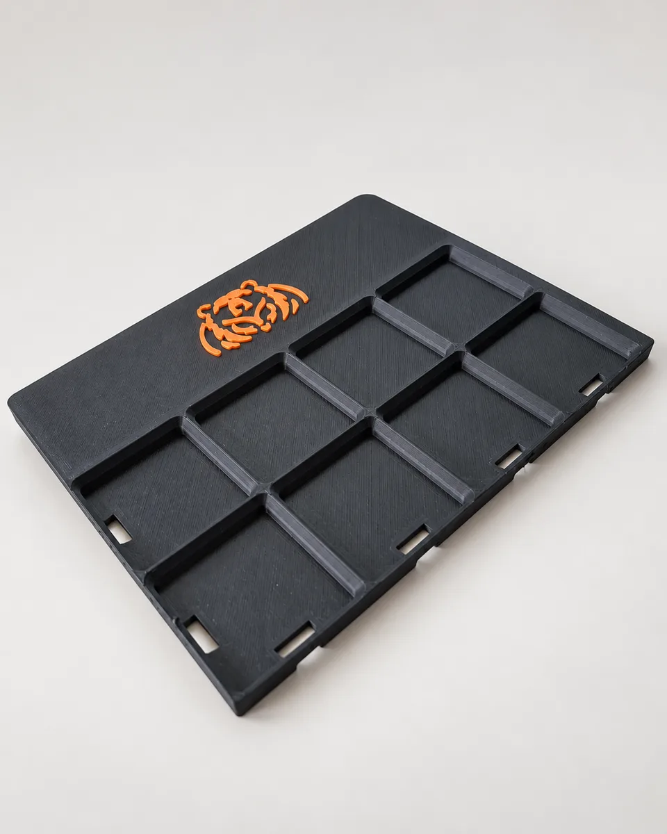 Black 8-compartment Gridfinity tray plate with an orange BOWLDER bear logo